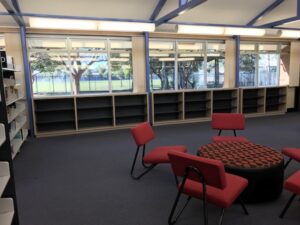 Additional library shelving in Classic Oak with Charcoal back and shelving at Liverpool Boys High School